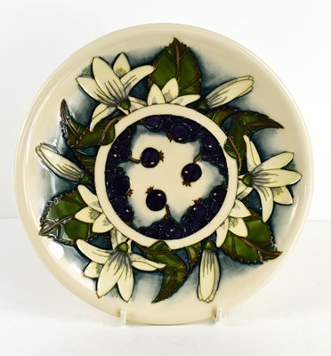 Lot 137 - A Moorcroft plate, in the Blueberry and white...