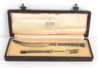 Lot 330 - An Omar Ramsden silver fruit knife and fork...