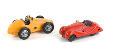 Lot 355 - Two vintage Schuco wind up toy cars comprising...