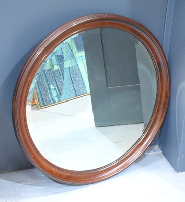 Lot 425 - A circular mahogany Victorian wall mirror, the...