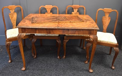 Lot 422 - A burr walnut extending dining table with...