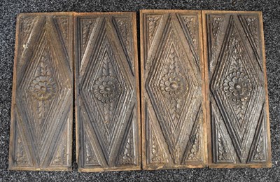 Lot 455 - A set of four 18th century oak carved panels,...