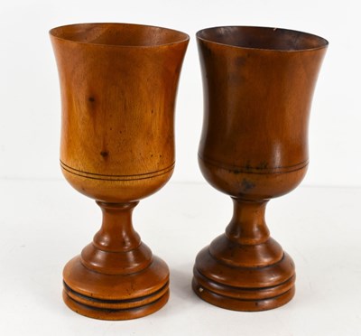 Lot 296 - A pair of treen goblets, turned to form...