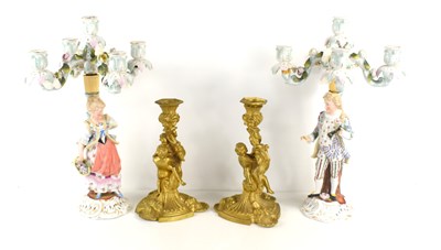 Lot 196 - A pair of French style gilt metal candlesticks...