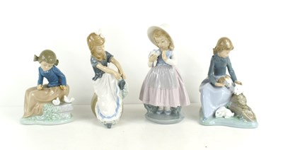 Lot 168 - A group of four Lladro Nao porcelain figurines...