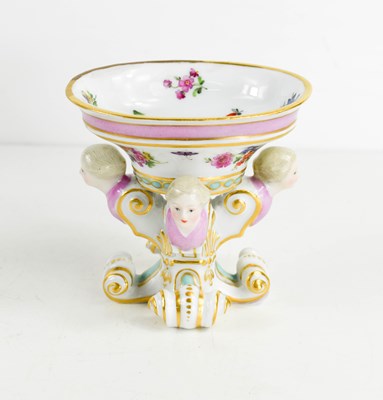 Lot 179 - A 19th century Meissen salt, raised above four...