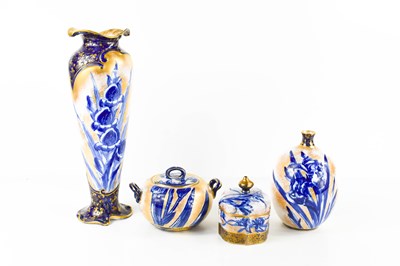 Lot 190 - A group of four Royal Doulton porcelain pieces,...