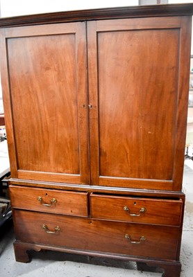 Lot 435 - A 19th century mahogany press cupboard, the...