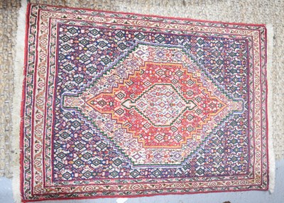 Lot 413 - A small Middle eastern rug / prayer mat with...