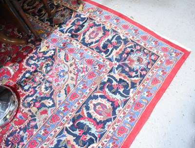 Lot 417 - A large Middle Eastern red ground rug with...