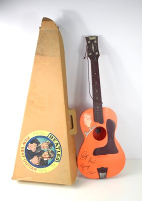 Lot 92 - A Selcol "New Beats" Beatles toy guitar with...