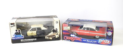 Lot 11 - Two boxed Ertl Joyride 1:18 scale diecast...