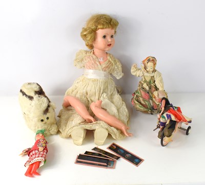 Lot 27 - A vintage doll together with a cuddly toy with...