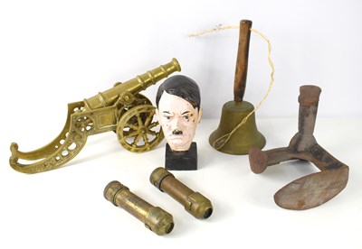 Lot 104 - A brass cannon together with a bronze hand...