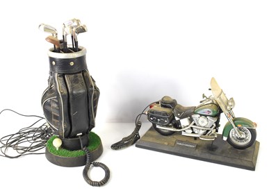Lot 29 - A novelty telephone in the form of a bag of...