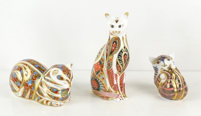 Lot 229 - A group of three Royal Crown Derby cat...