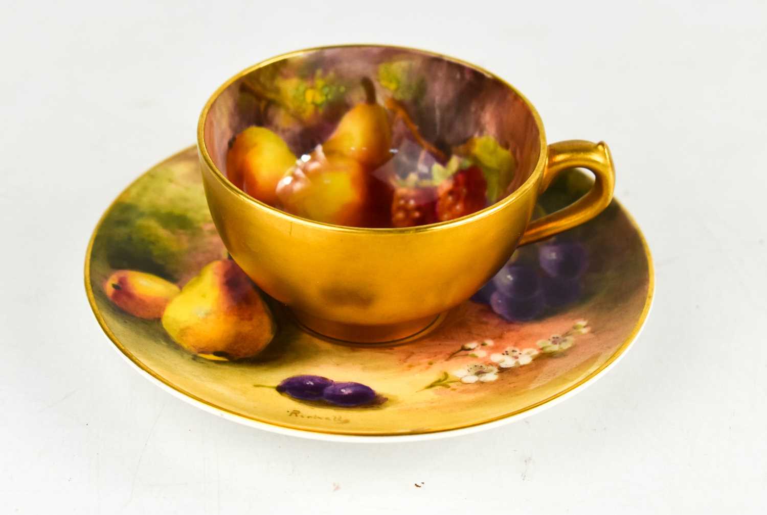 Lot 27 - A Royal Worcester miniature cup and saucer,...