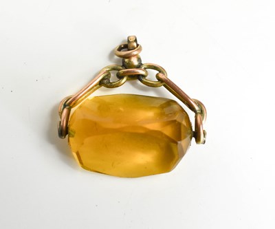 Lot 84 - A 9ct gold and citrine swivel fob.