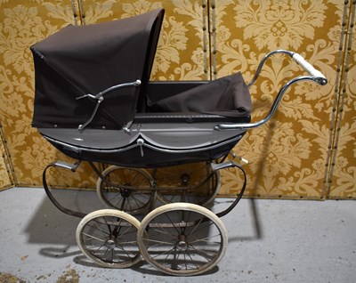 Lot 97 - A small silver cross dolls pram.