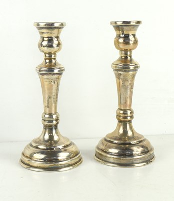 Lot 388 - A pair of Egyptian silver candlesticks, fully...