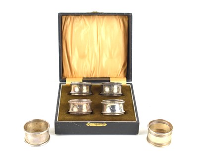 Lot 359 - A cased set of four silver napkin rings,...