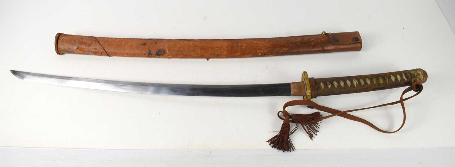 Lot 256 - A WWII Japanese Officers sword and leather...