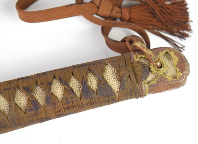 Lot 256 - A WWII Japanese Officers sword and leather...