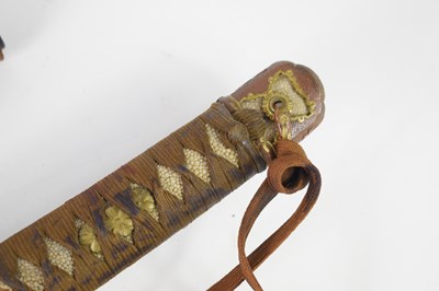 Lot 256 - A WWII Japanese Officers sword and leather...