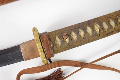 Lot 256 - A WWII Japanese Officers sword and leather...