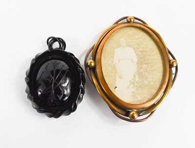 Lot 182 - A Victorian jet pendant, of carved oval form,...