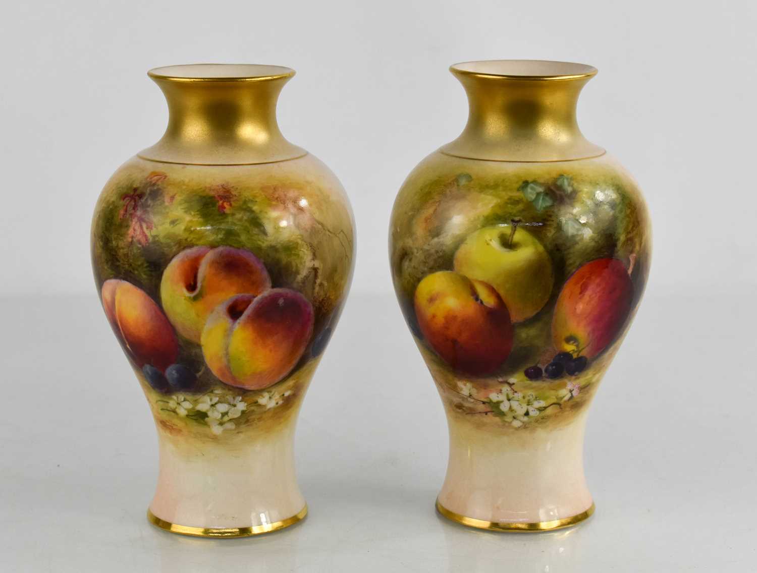 Lot 2 - A pair of Royal Worcester vases by Rickets,...
