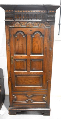 Lot 626 - A 20th Century oak single door wardrobe in the...