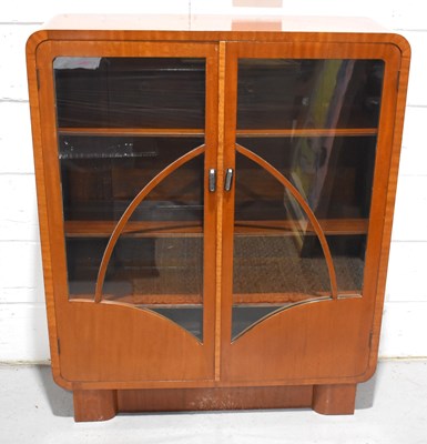 Lot 625 - A 1920s mahogany twin door glass display...