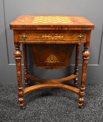 Lot 633 - A Victorian walnut games table with chess...