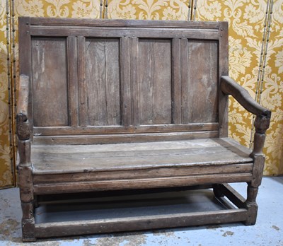 Lot 660 - An 18th century oak or elm settle, the high...