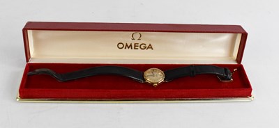 Lot 196 - An Omega 9ct gold wristwatch, with black...