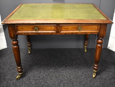 Lot 639 - A Victorian oak writing desk with green...