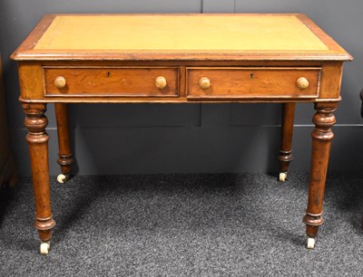 Lot 632 - A Victorian oak two drawer writing desk with...