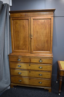 Lot 658 - A Georgian oak cabinet on chest, the upper...