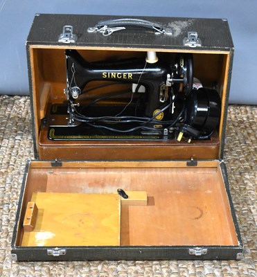 Lot 107 - A vintage Singer sewing machine, circa 1950,...