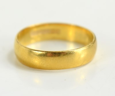 Lot 123 - A 22ct gold wedding band, size N, 3.8g.