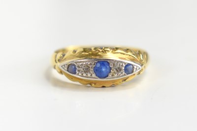 Lot 118 - An 18ct gold, platinum, sapphire and diamond...