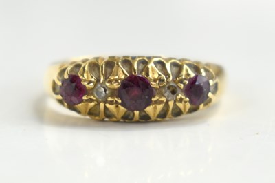 Lot 124 - An 18ct gold, ruby and diamond five stone ring,...