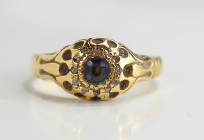 Lot 125 - An 18ct gold, sapphire and diamond ring, the...