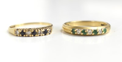 Lot 122 - A 9ct gold seven stone emerald and diamond...