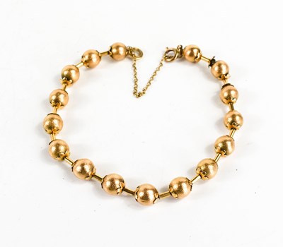 Lot 11 - A Victorian gold bracelet of ball and bar form,...