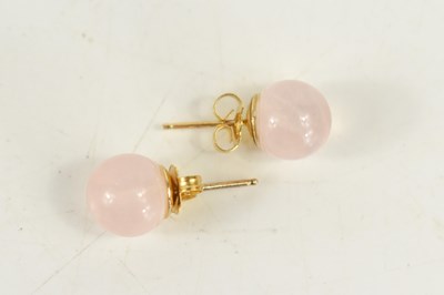 Lot 86 - An almost pair of rose quartz and gold...