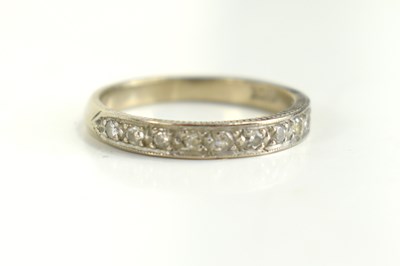 Lot 121 - An 18ct gold and diamond half eternity ring,...