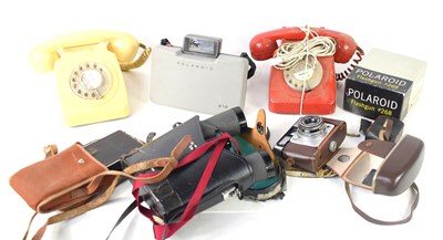 Lot 124 - Two vintage telephones together with Polaroid...