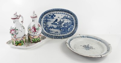 Lot 220 - A French Faience pottery pair of Oil & Vinegar...